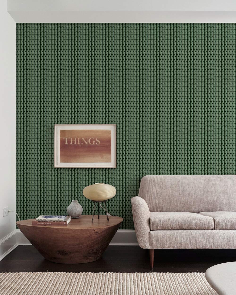 Elegant forest green geometric wallpaper in modern living room with beige sofa and wood table.
