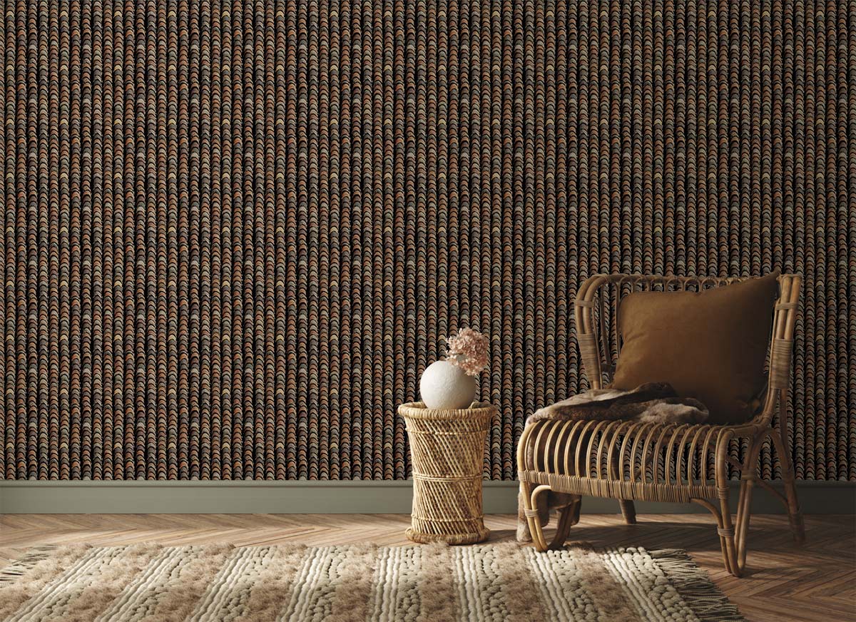 Elegant bronze-black chevron wallpaper in styled room with wicker chair, textured rug, wooden flooring.