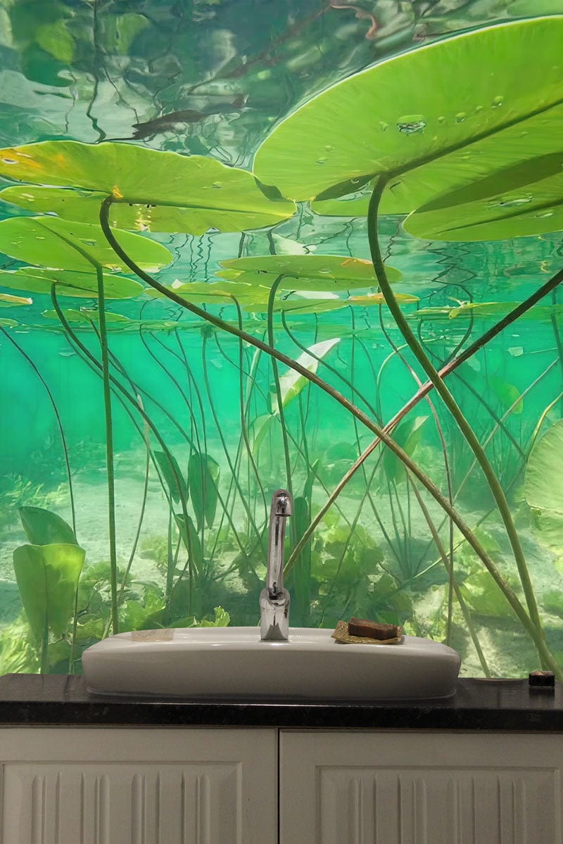 Underwater lily pond mural in calming green, featured with white bathroom cabinets and stylish washbasin.