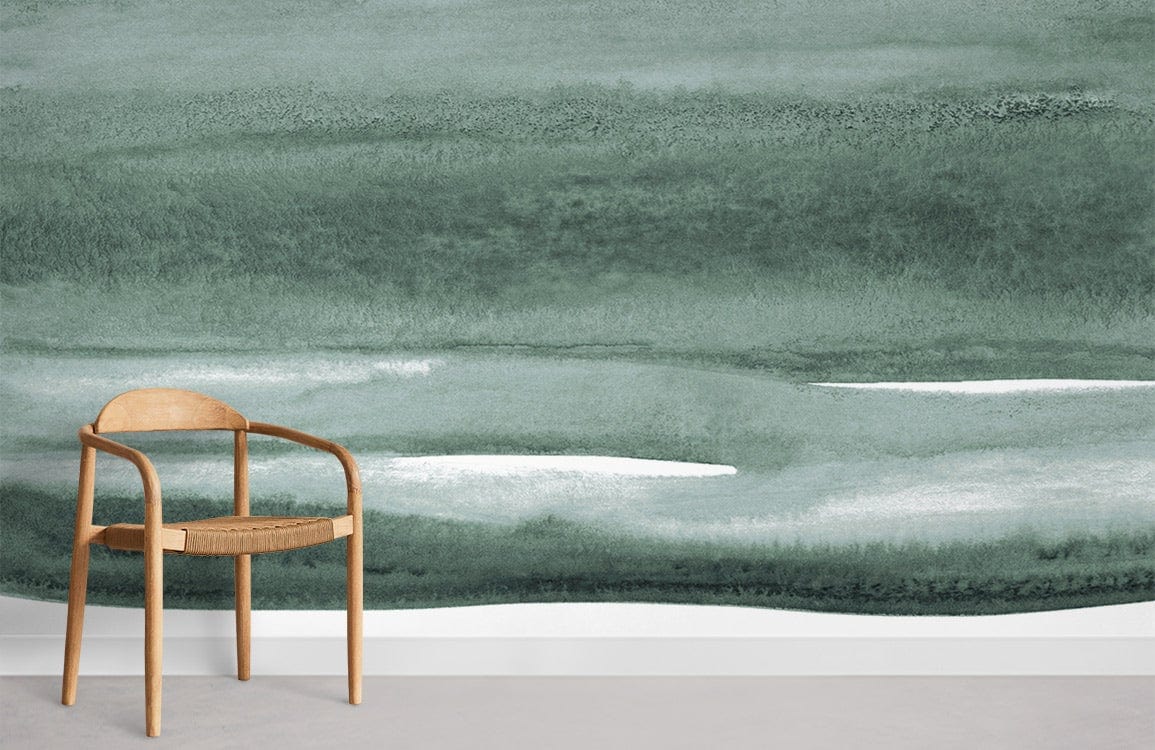 Sage green watercolour mural wallpaper with minimalist wooden chair and modern grey floor in stylish room.