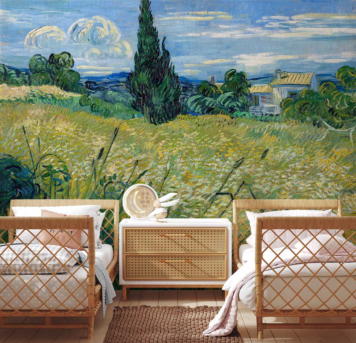 Serene countryside mural wallpaper in vibrant hues, wicker twin beds, neutral rug, wooden floor, bedroom setting.