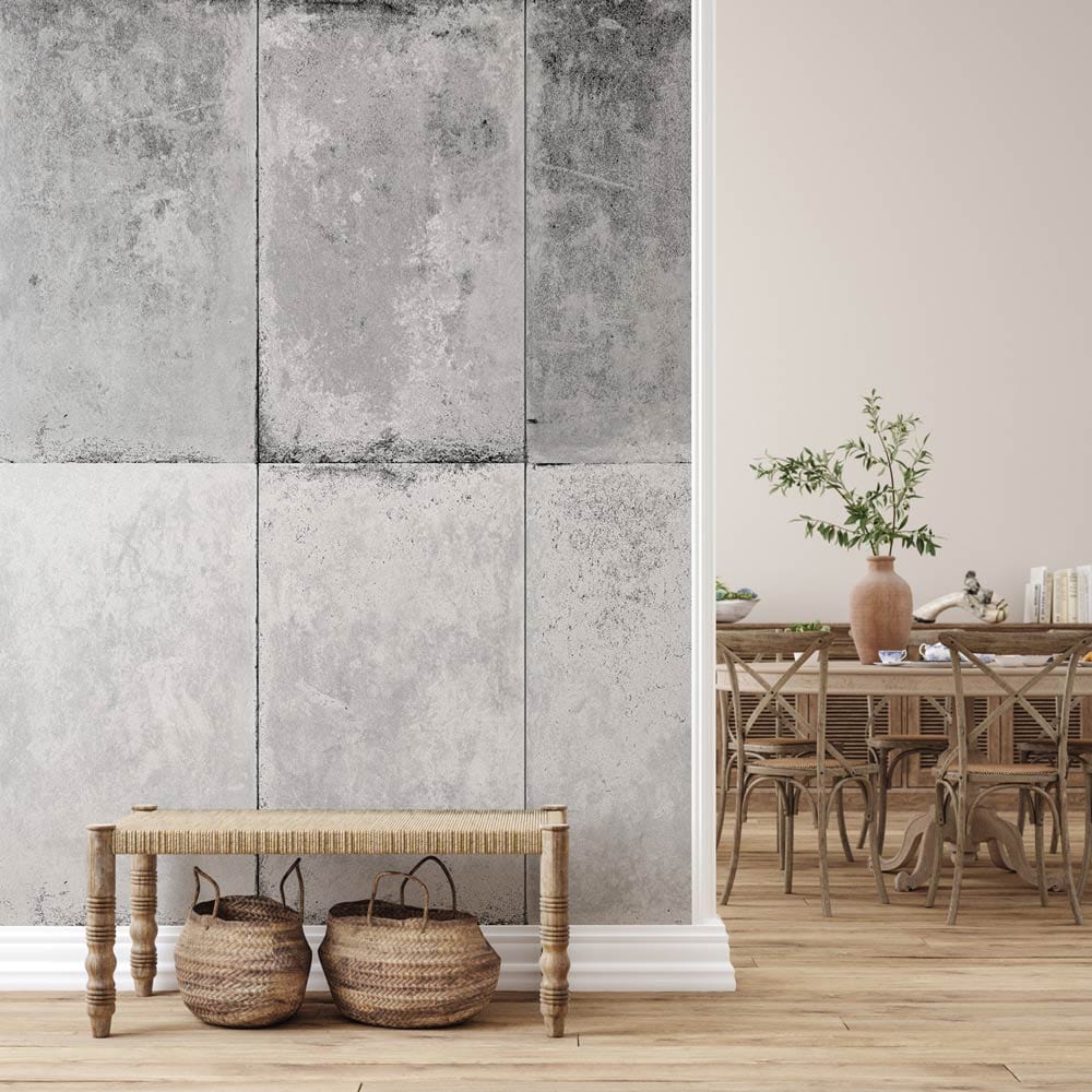 Industrial grey concrete effect wallpaper in rustic urban chic dining room with wooden chairs and bench.
