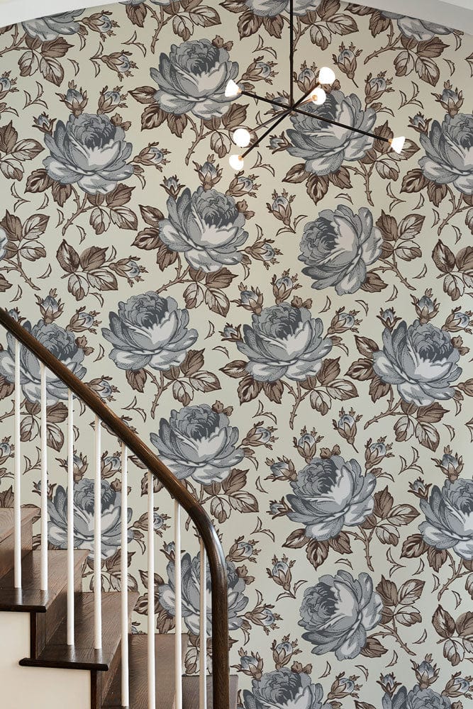 Elegant vintage floral wallpaper with blue and brown rose pattern, stylish staircase, modern chandelier.