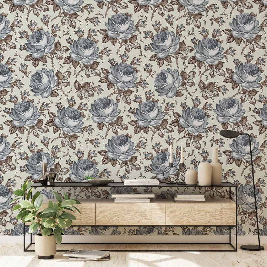 Vintage floral wallpaper in room with vintage sideboard, emphasising blue and brown rose pattern design.