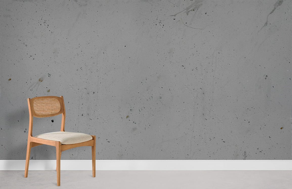Vintage slate-grey textured wallpaper in modern room with light wood chair and white skirting board.