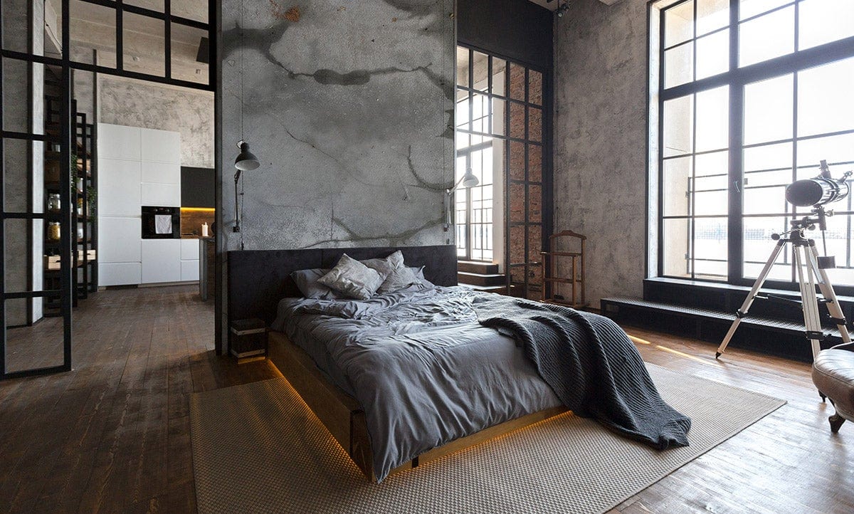 Vintage grey marble effect wallpaper in stylish bedroom with modern bed, wooden flooring, and large windows.