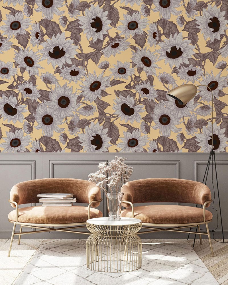 Vintage sunflower pattern wallpaper in living room with brown velvet sofas, grey panel wall, beige rug.