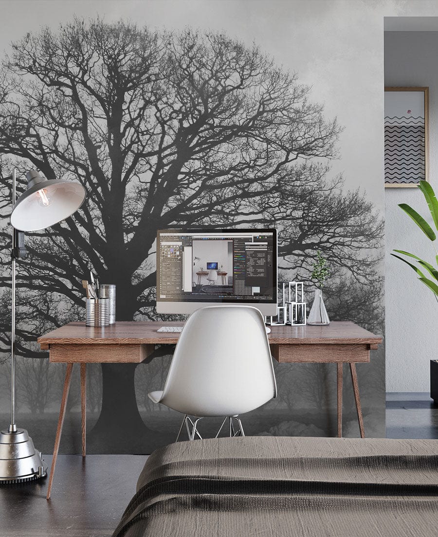 Majestic Black Oak Tree wallpaper mural in modern study with wooden desk, white chair, and floor lamp.