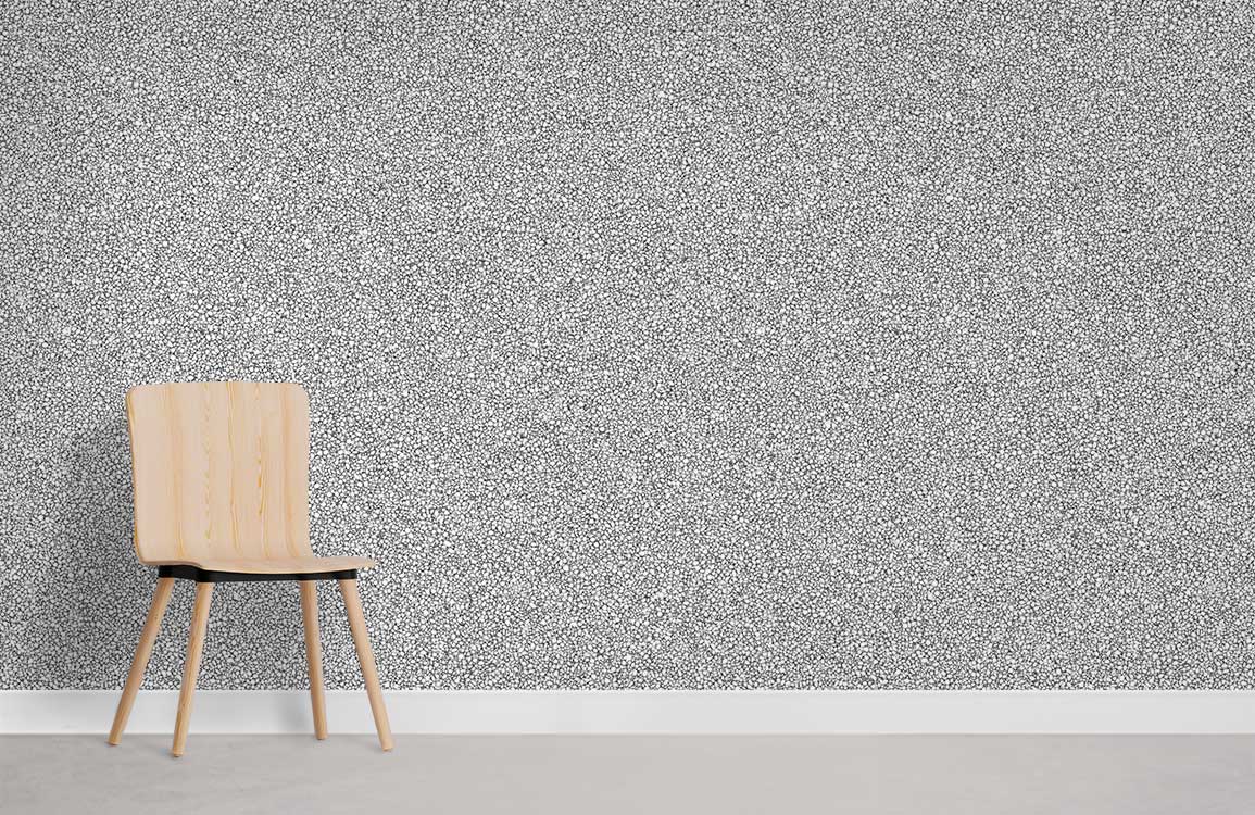 Elegant grey speckle textured wallpaper, modern interiors; light wood chair, neutral flooring.