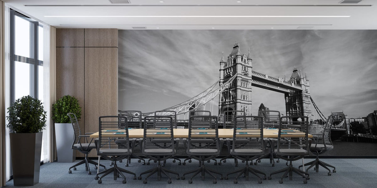 Black and white mural wallpaper of Tower Bridge in elegant office with modern conference table and chairs.