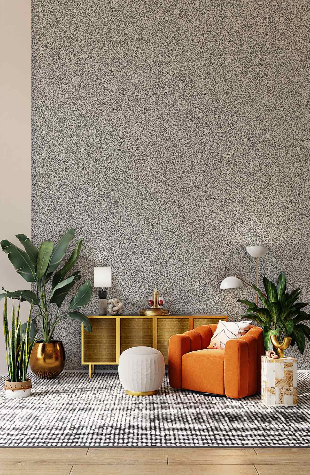 Elegant grey speckle textured wallpaper in modern living room with orange sofa and wood flooring.