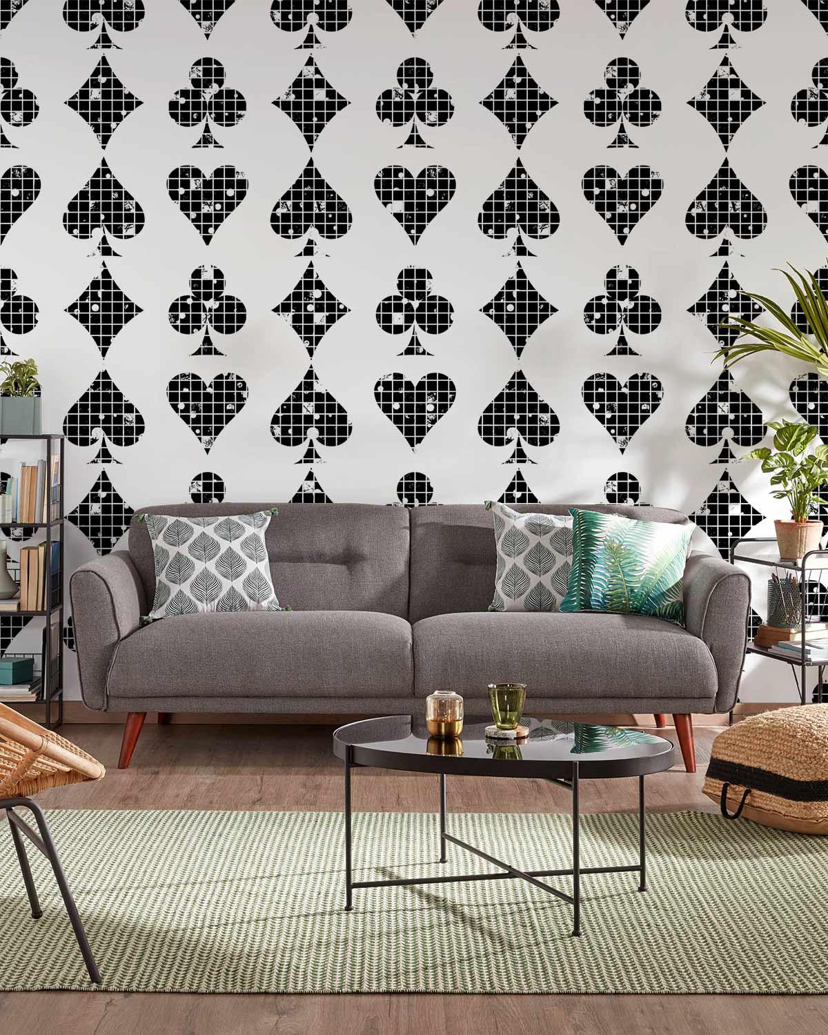 Monochrome retro geometric wallpaper, grey sofa, modern rug, wooden flooring, contemporary living room decor.