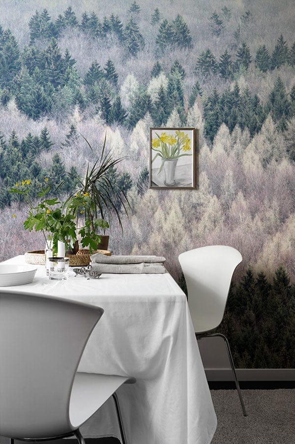 Tranquil Misty Forest Wallpaper with white dining chairs, table, and grey carpeted flooring.