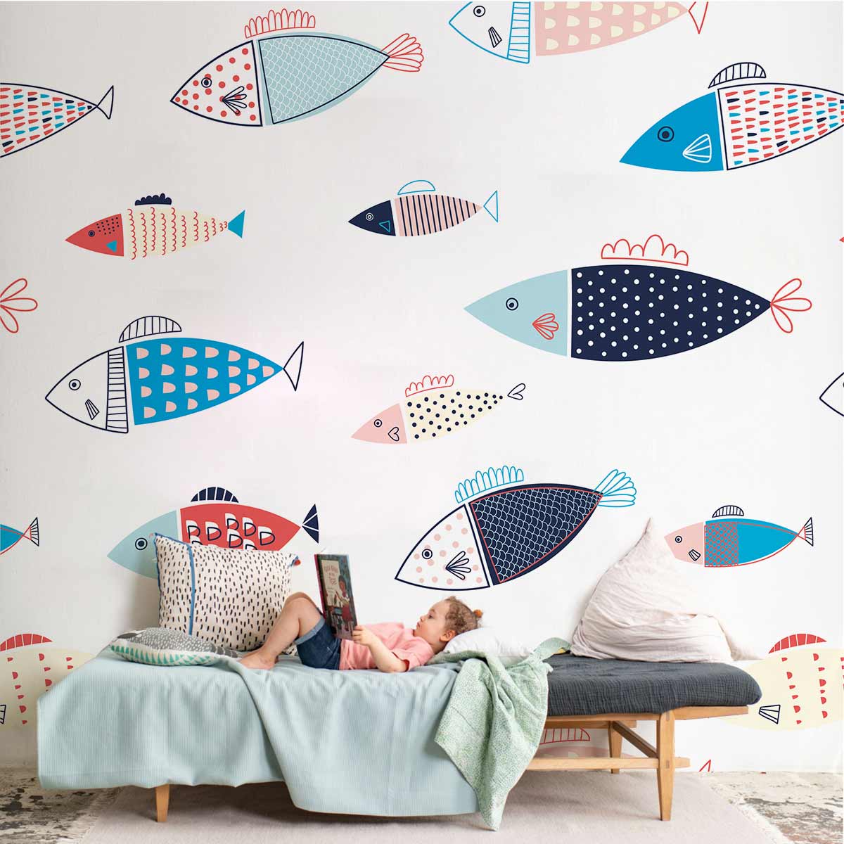 Playful multicoloured fish wallpaper in children's room with light sofa, playful and nautical-themed decor.