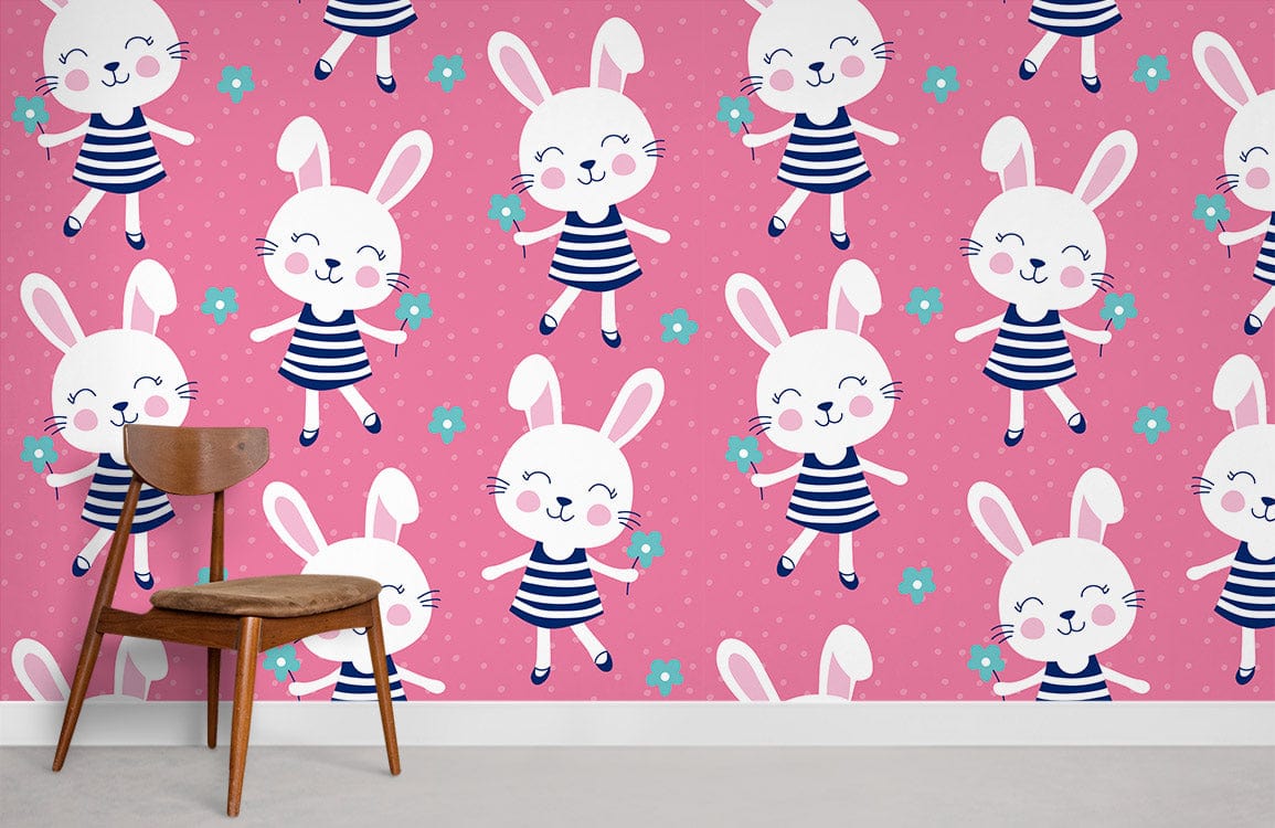 Adorable pink bunny wallpaper with stripes and flowers in children's room, wooden chair, grey flooring.