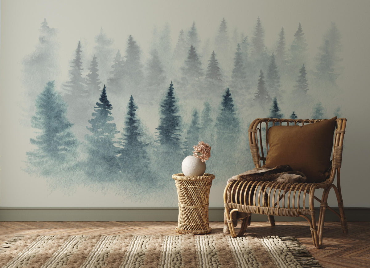 Serene Misty Forest mural wallpaper in soft blue and grey, wicker chair, rug, natural wood flooring.