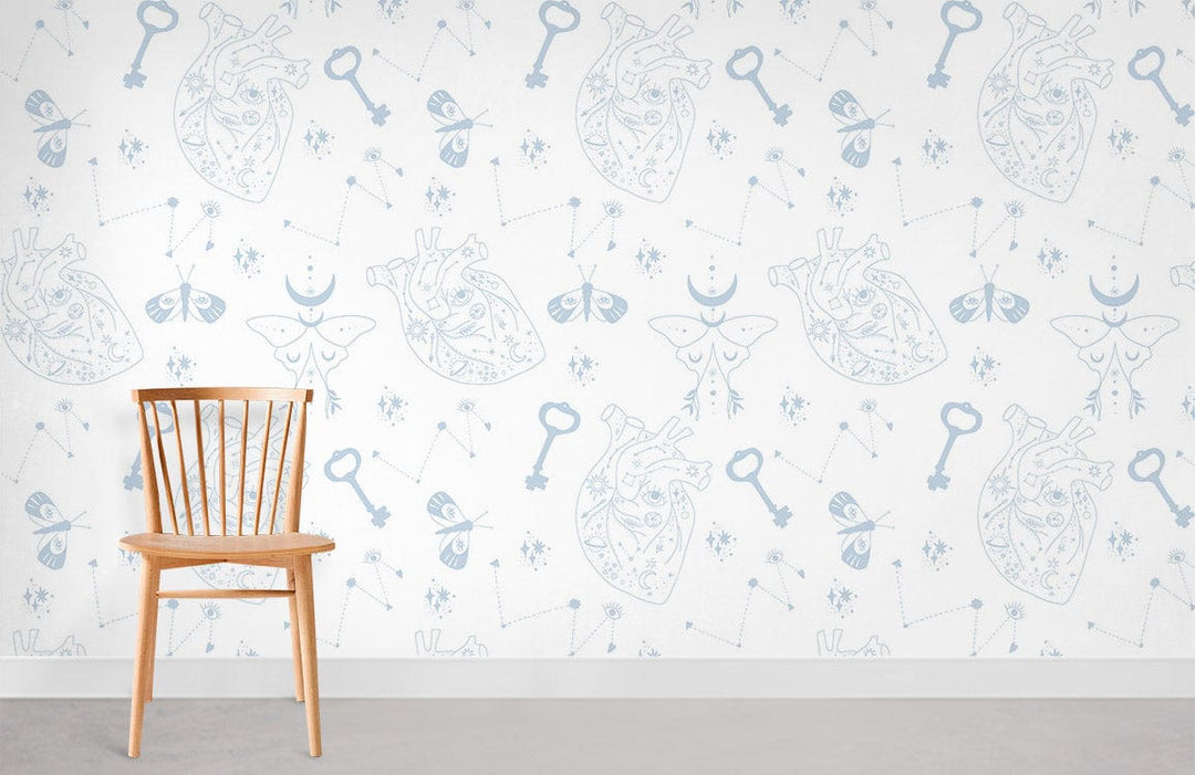Delicate Blue Vintage Heart and Key Wallpaper Design with wooden chair, white wall, concrete flooring.