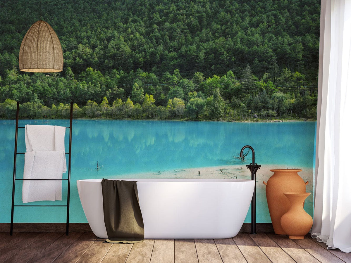 Tranquil mural wallpaper in serene blue, featuring lake and forest. White bathtub, wooden flooring, pendant light.
