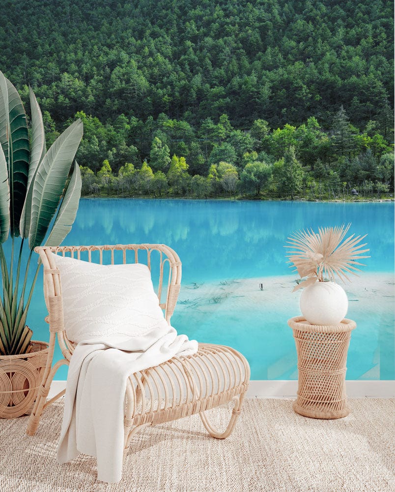 Tranquil lake mural wallpaper, wicker chair, white cushion, woven rug, serene blue lake view.