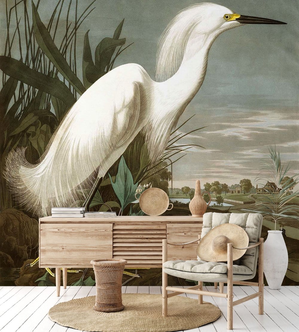 Elegant White Egret Mural Wallpaper, mid-century wood cabinet, cushioned chair, serene landscape scene, woven rug.
