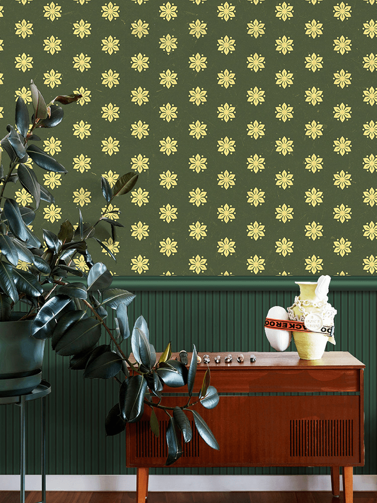 Vintage olive green floral wallpaper in elegant room with wooden sideboard and lush plant decor.