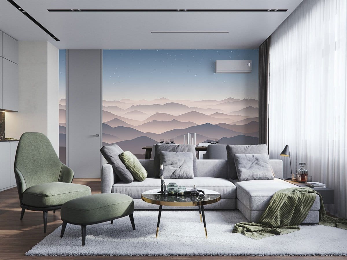 Dreamy Misty Mountains Landscape Mural in living room with grey sofa, green chairs, wooden flooring.