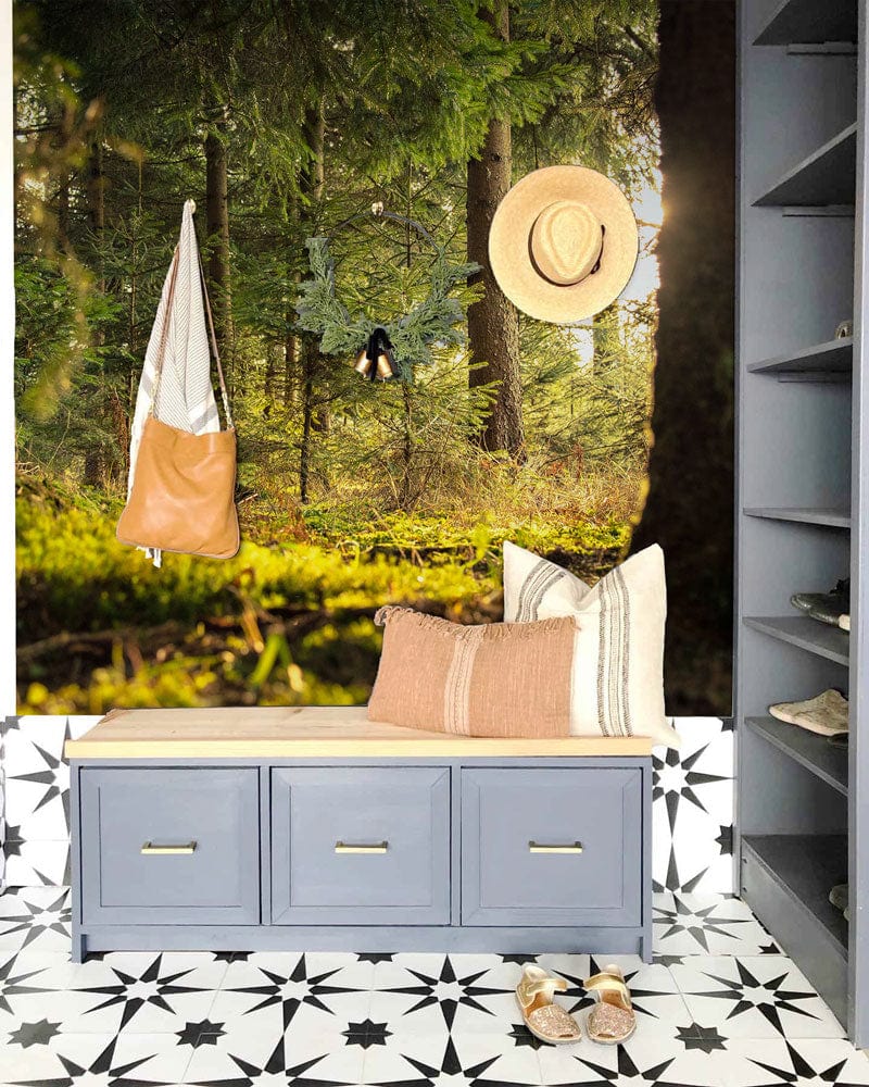 Tranquil Forest Green Nature Mural in hallway, blue bench, tiled flooring, hat hanging, handbag visible.