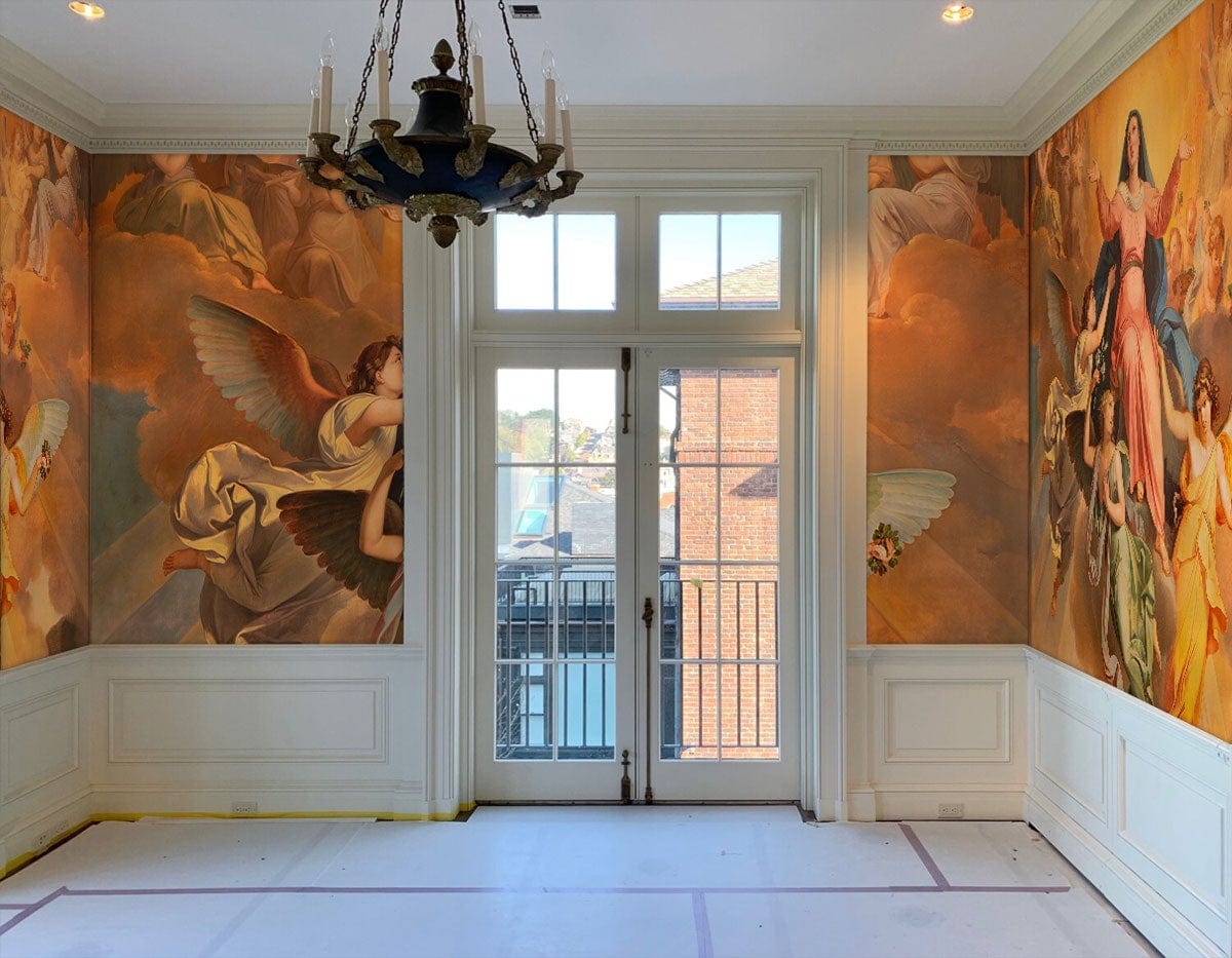 Heavenly Angels Renaissance mural wallpaper with rich tones in elegant living room featuring chandelier.