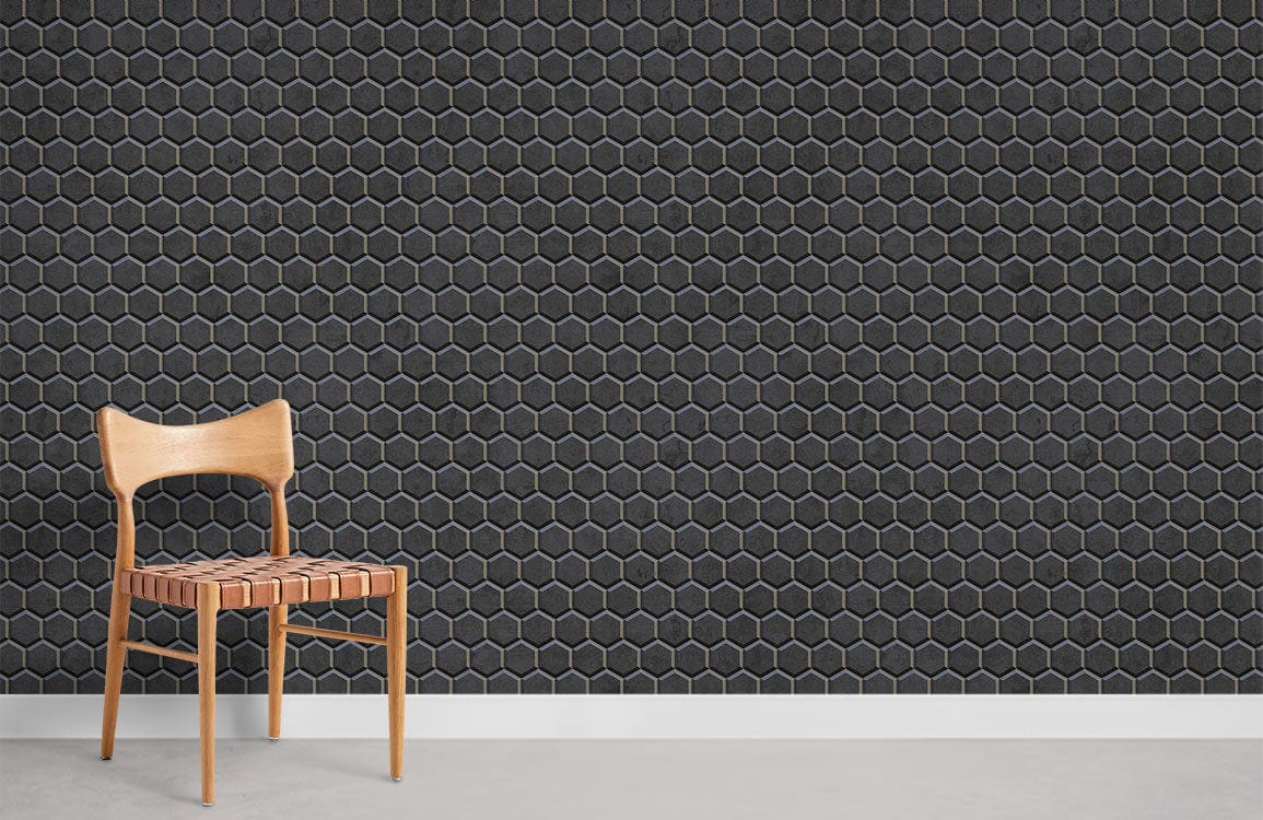Dark grey hexagonal wallpaper with natural chair, concrete flooring, modern geometric wall design.
