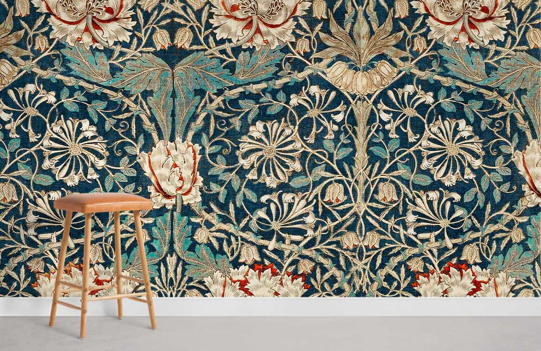 Vintage floral tapestry wallpaper in rich tones complements light wooden stool, enhancing classic room style.
