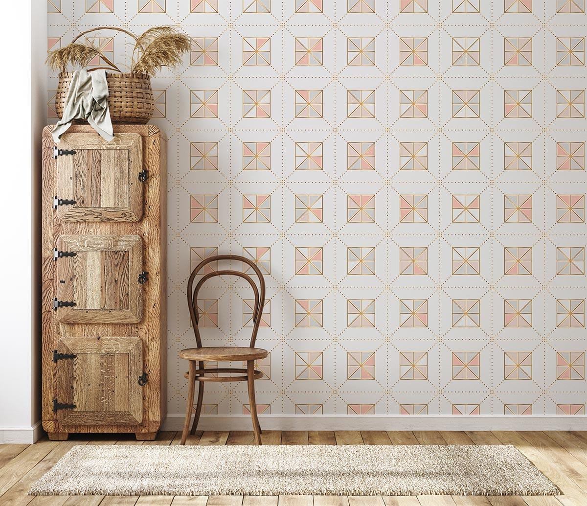 Geometric pink and gold wallpaper, rustic cabinet, wooden chair, light wood flooring in elegant interior.