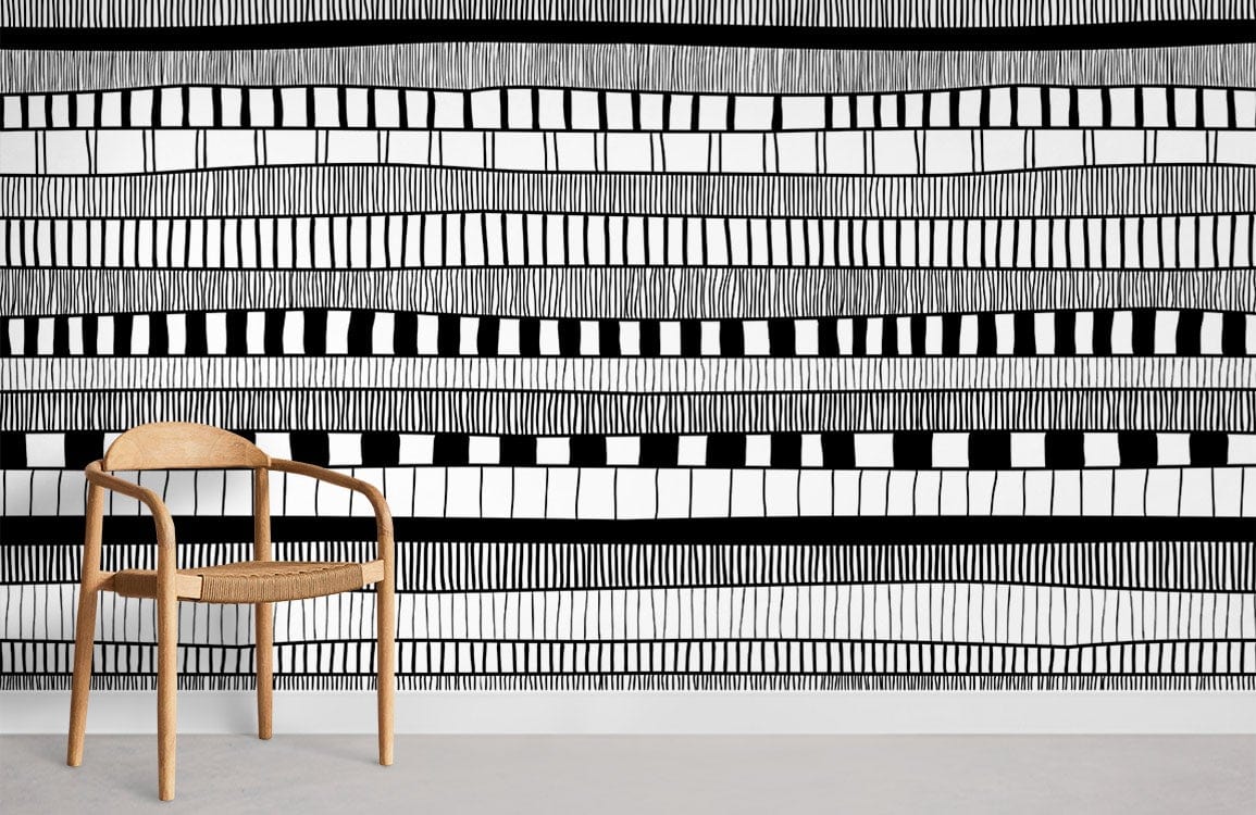 Monochrome geometric wallpaper with abstract patterns; wooden chair; minimalist design; black and white decor.