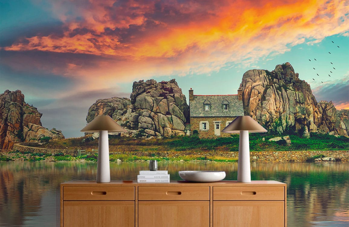 Rustic Coastal Sunset Mural Wallpaper with tranquil waters, rocky cliffs, wooden sideboard, modern lamps.