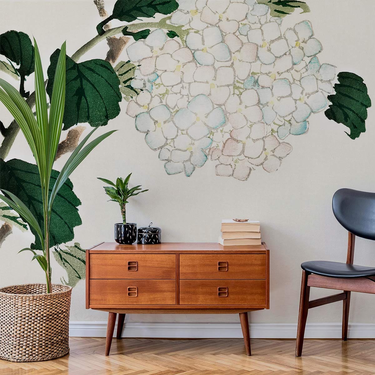 Elegant vintage hydrangea wallpaper in watercolour style, wooden furniture, chevron flooring, black chair.
