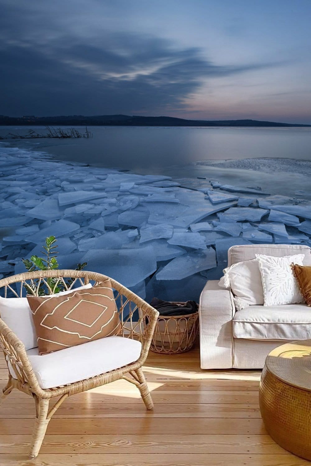 Elegant Frozen Lake Wallpaper in living room with beige sofa, rattan chair, wooden flooring. Tranquil decor.