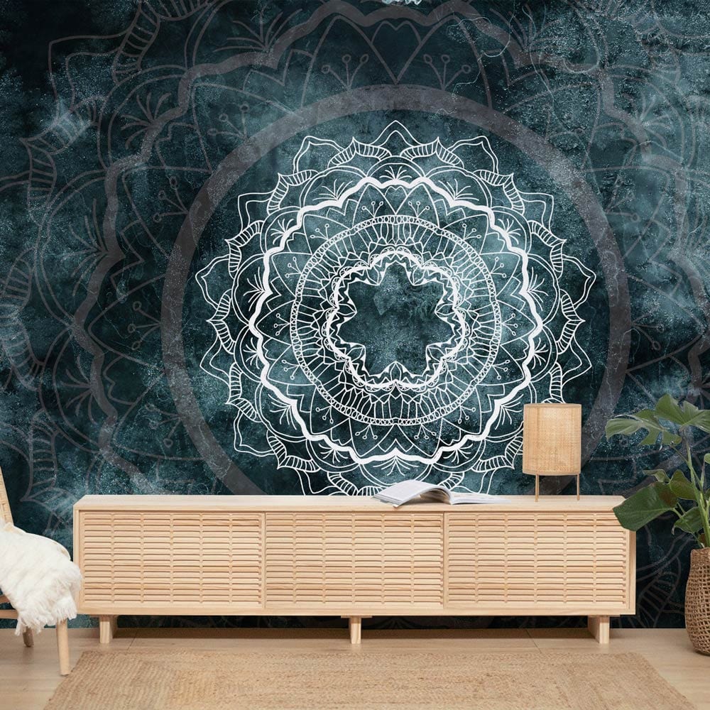 Teal Mandala Mist wallpaper with intricate patterns, light wood bench, hardwood flooring in living room.