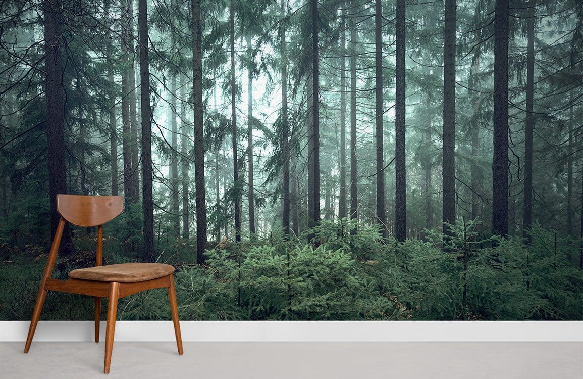 Enchanted Forest Mural Wallpaper in misty green, wooden chair, beige carpet, modern interior decor.
