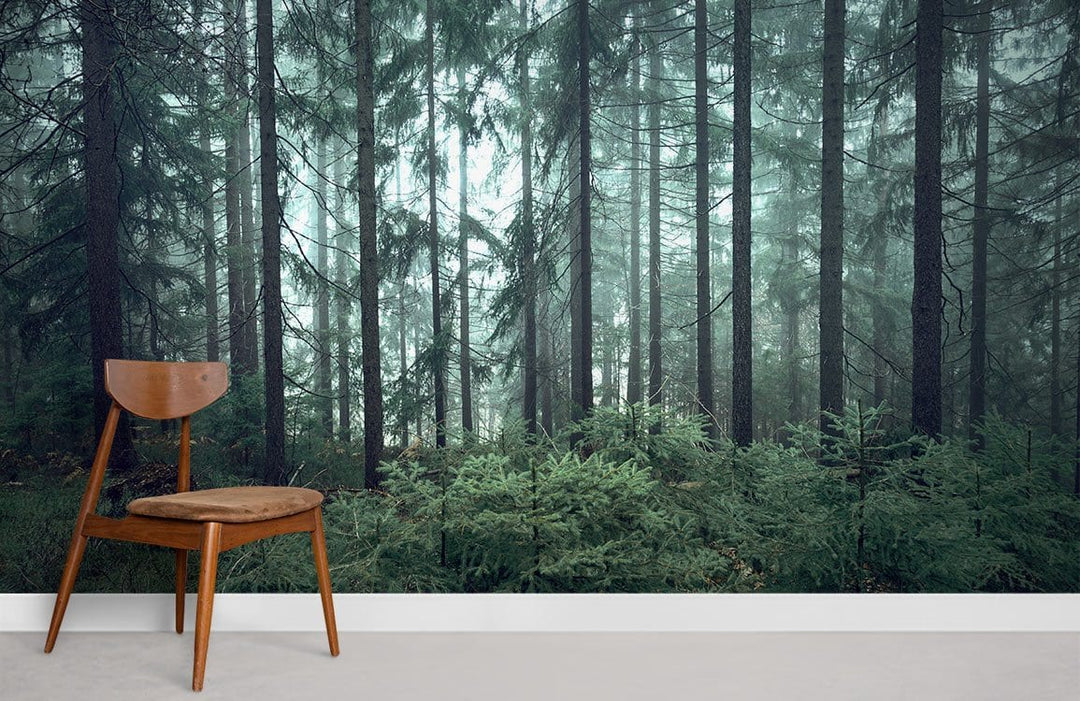 Enchanted Forest Mural Wallpaper in misty green, wooden chair, beige carpet, modern interior decor.