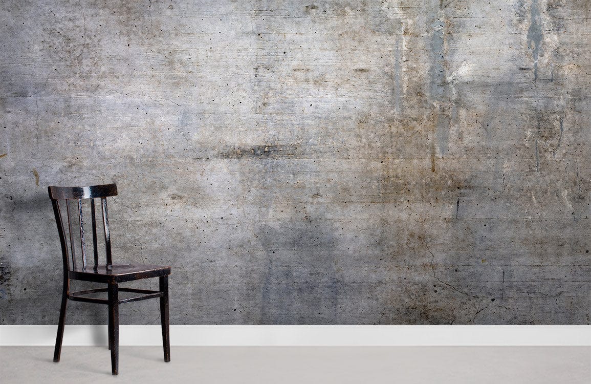 Industrial grey concrete mural wallpaper with rustic black chair on white skirting, modern urban interior.