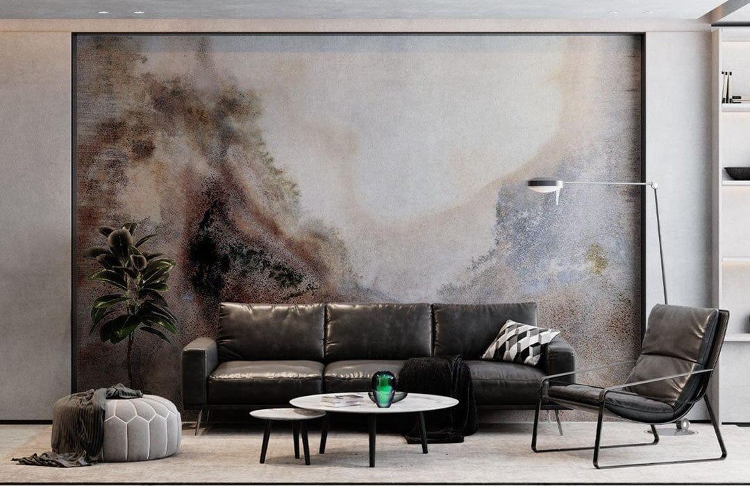 Watercolour Misty Mountain Landscape mural wallpaper in earthy tones behind black leather sofa, modern living room.