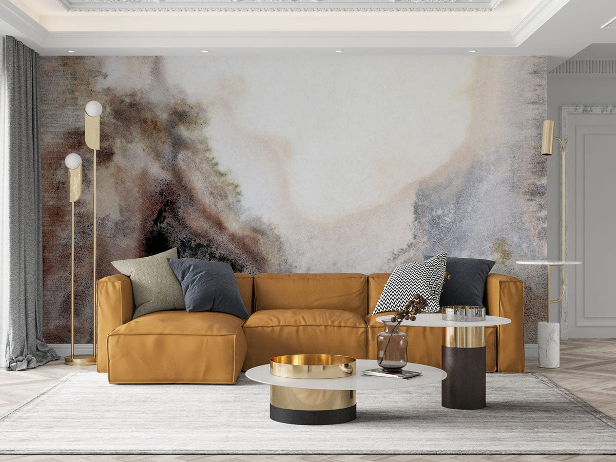 Misty mountain mural wallpaper with earthy tones, leather sofa, modern tables in elegant living room.