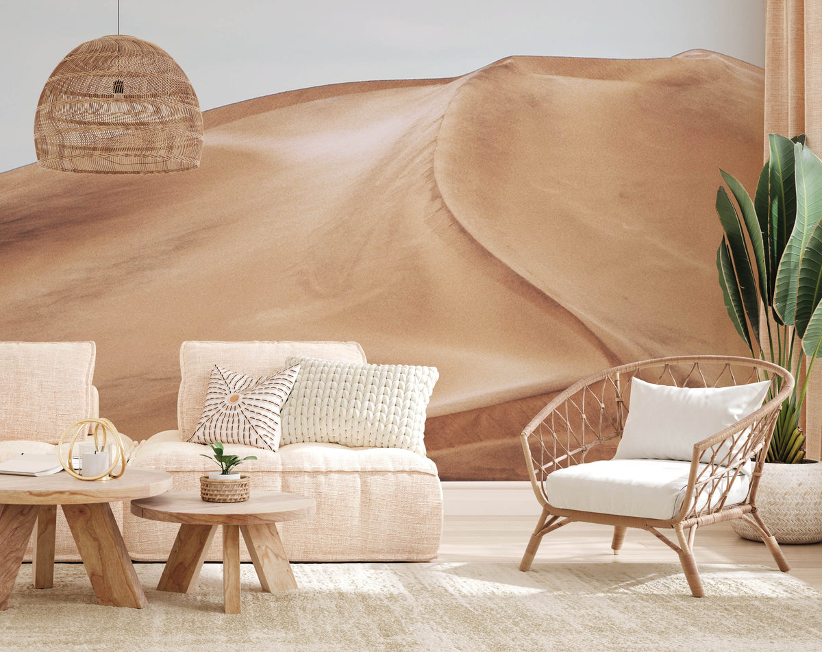 Natural Desert Sand Dune Mural, neutral sofa, wicker chair, wooden tables, woven pendant in living room.