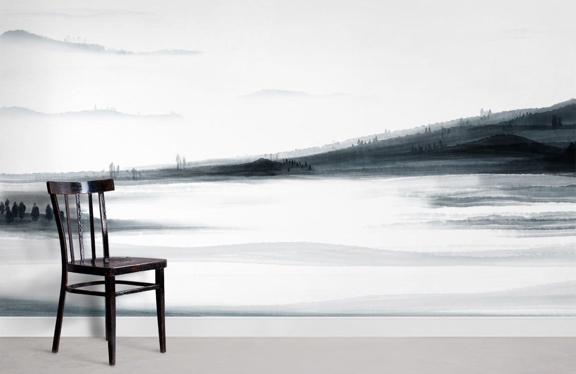 Monochrome misty landscape mural wallpaper with black chair; serene black and white design on wall.