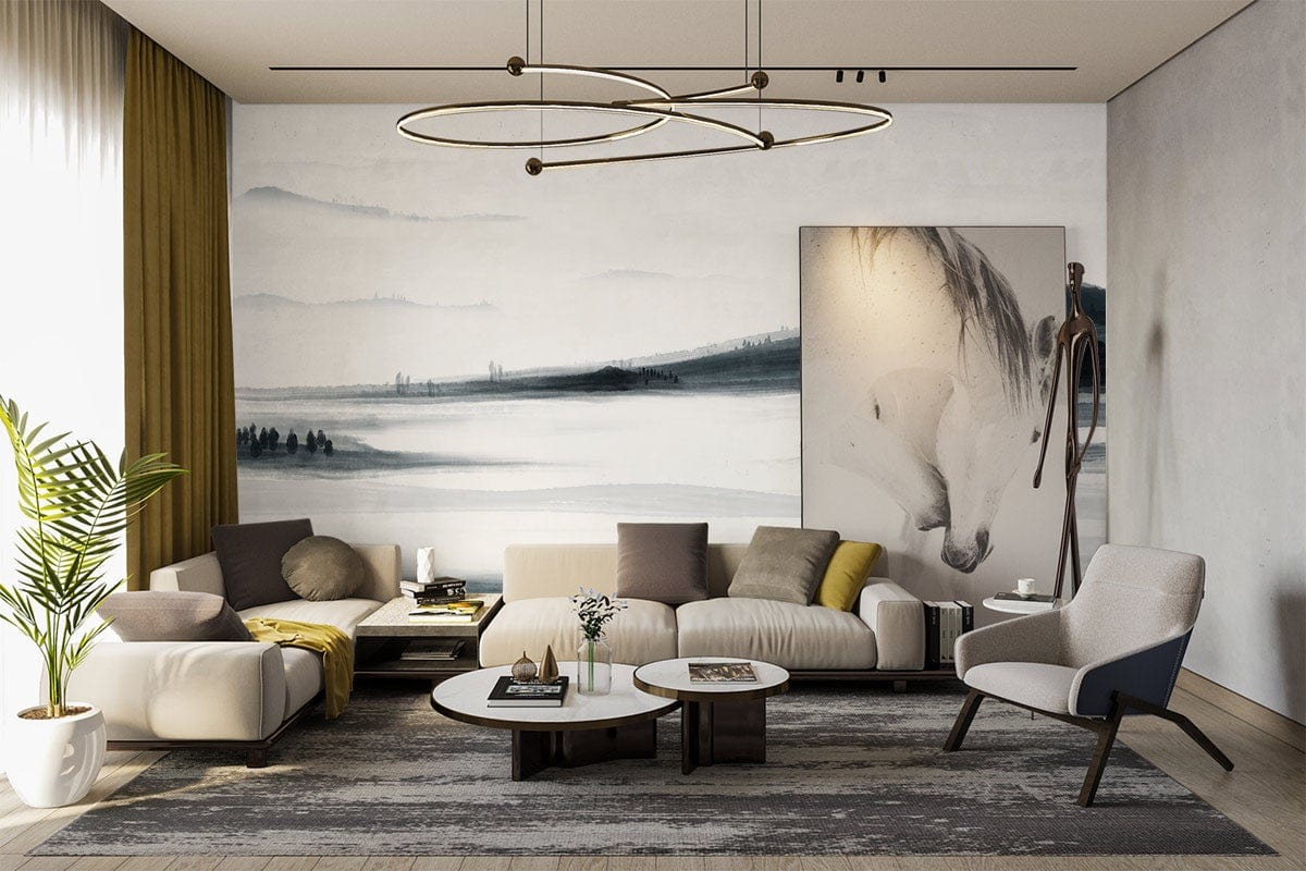 Modern living room with Monochrome Misty Landscape Mural Wallpaper, grey sofa, stylish armchair, and artwork.