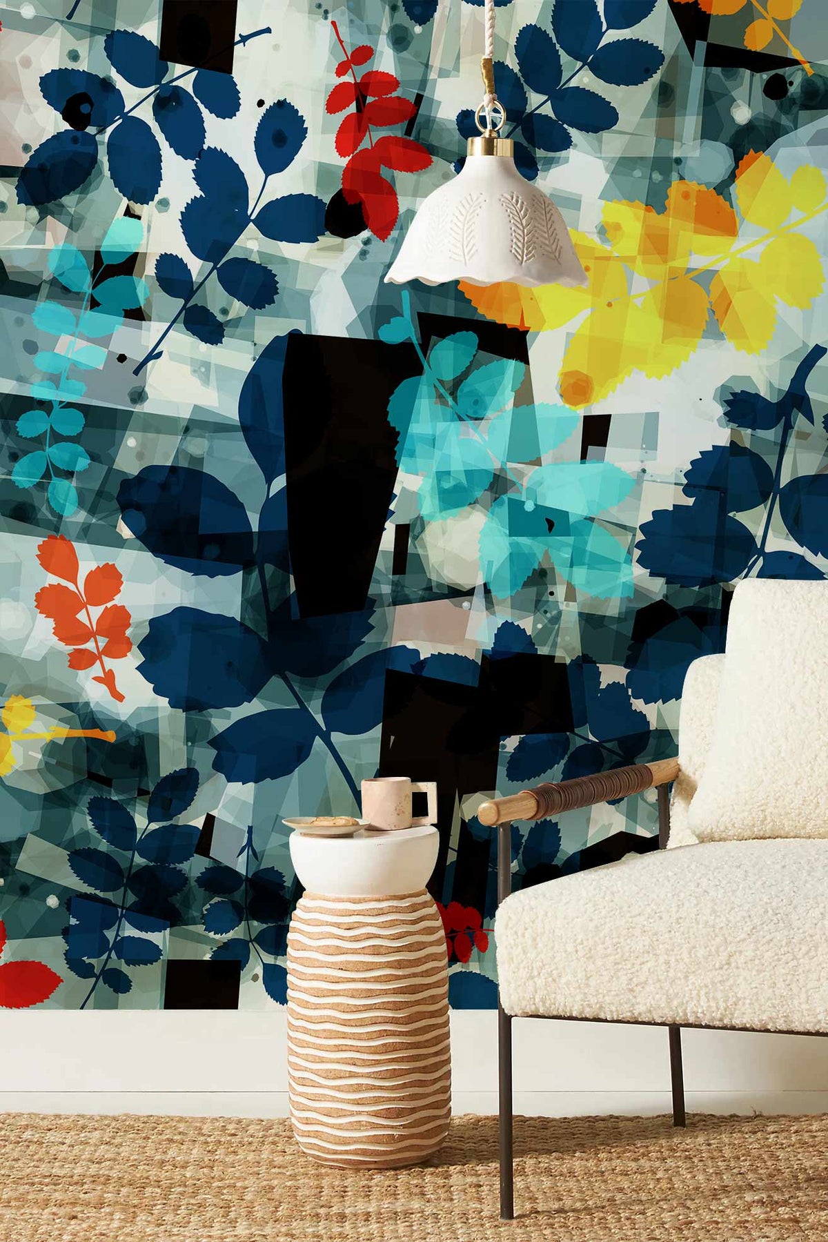 Wallpaper with vibrant floral design in blue, red, yellow hues; cosy cream chair; woven rug.
