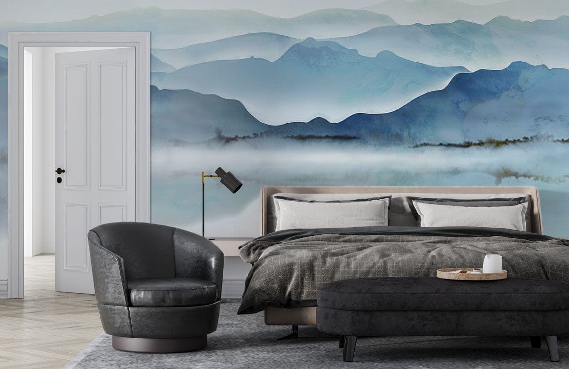 Tranquil Blue Misty Mountain Wallpaper in bedroom with grey chair, black lamp, soft bed, dark sofa.