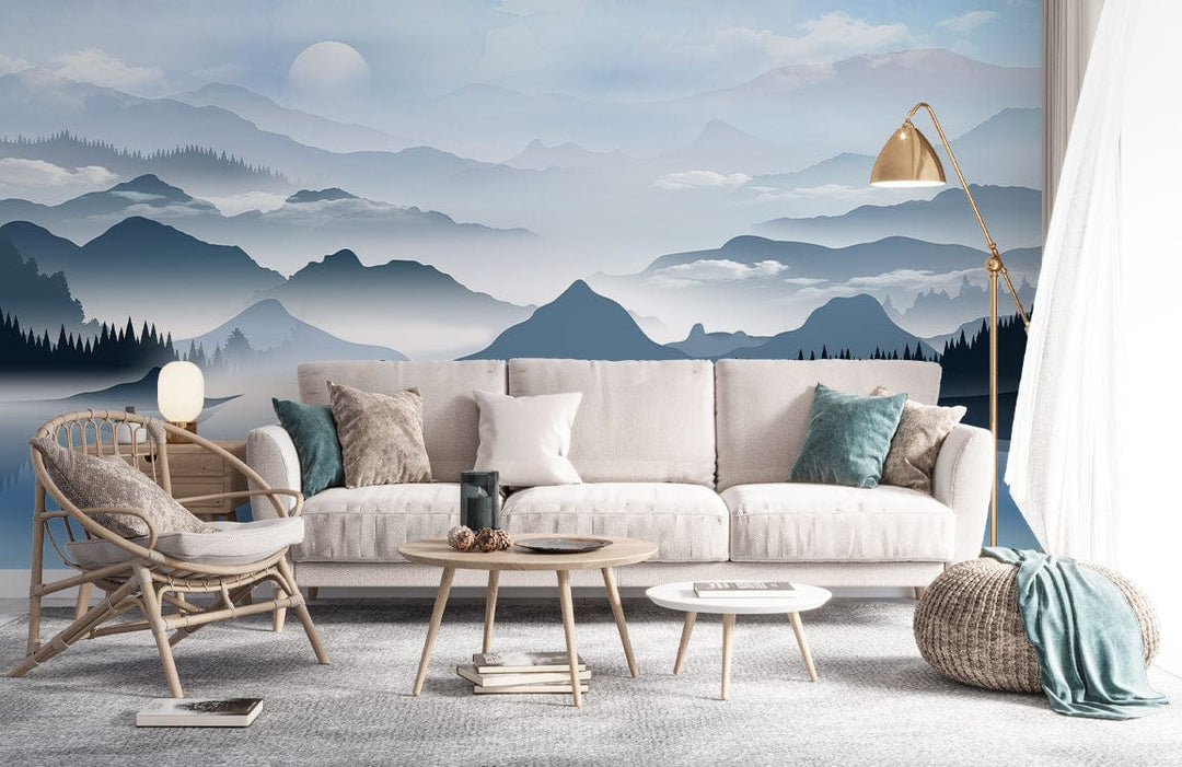 Serene Blue Mountain mural wallpaper, beige sofa, rattan chair, grey carpet, living room decor.
