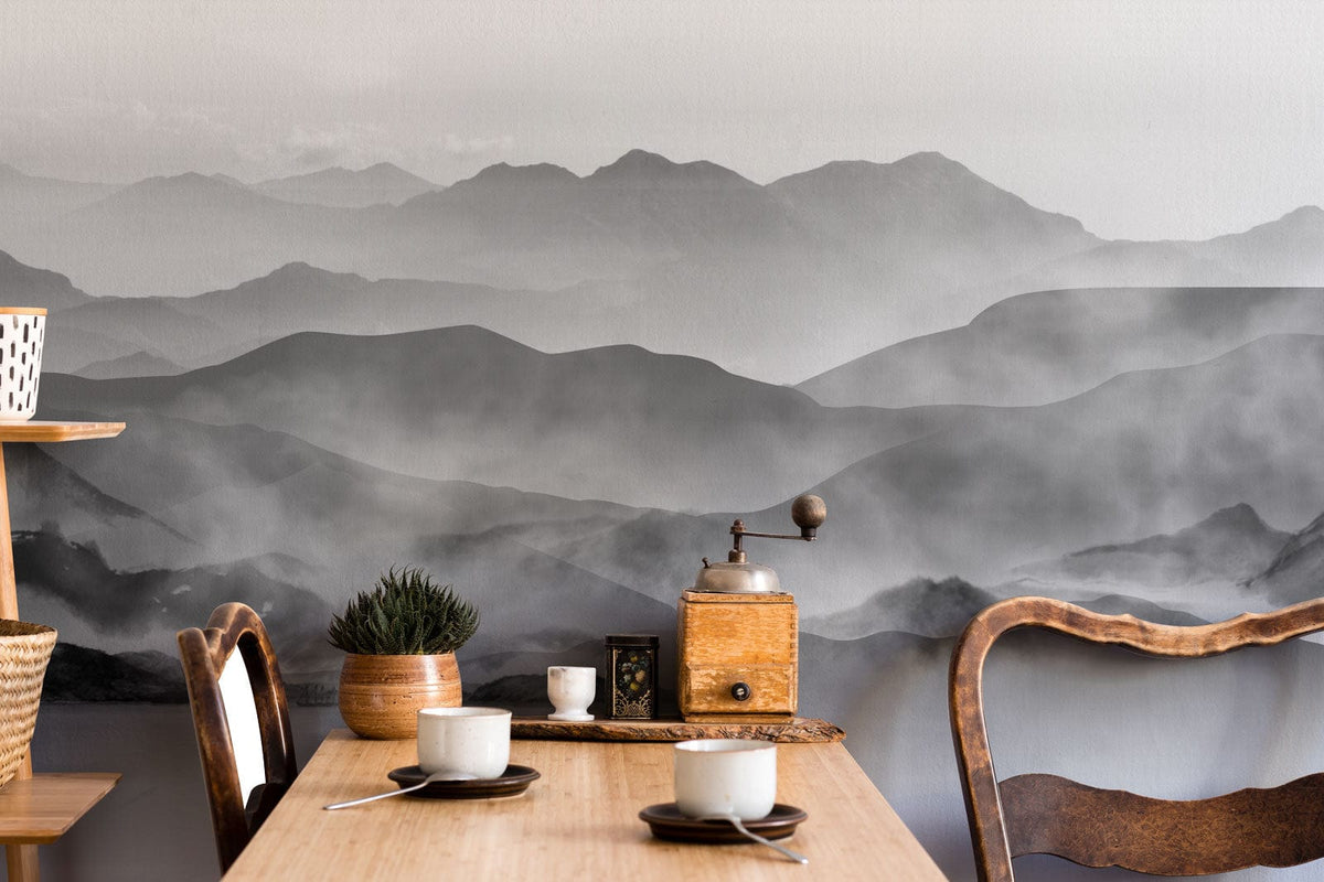 Monochrome Misty Mountain Landscape Mural Wallpaper, wooden chairs, dining table, serene nature-inspired decor.