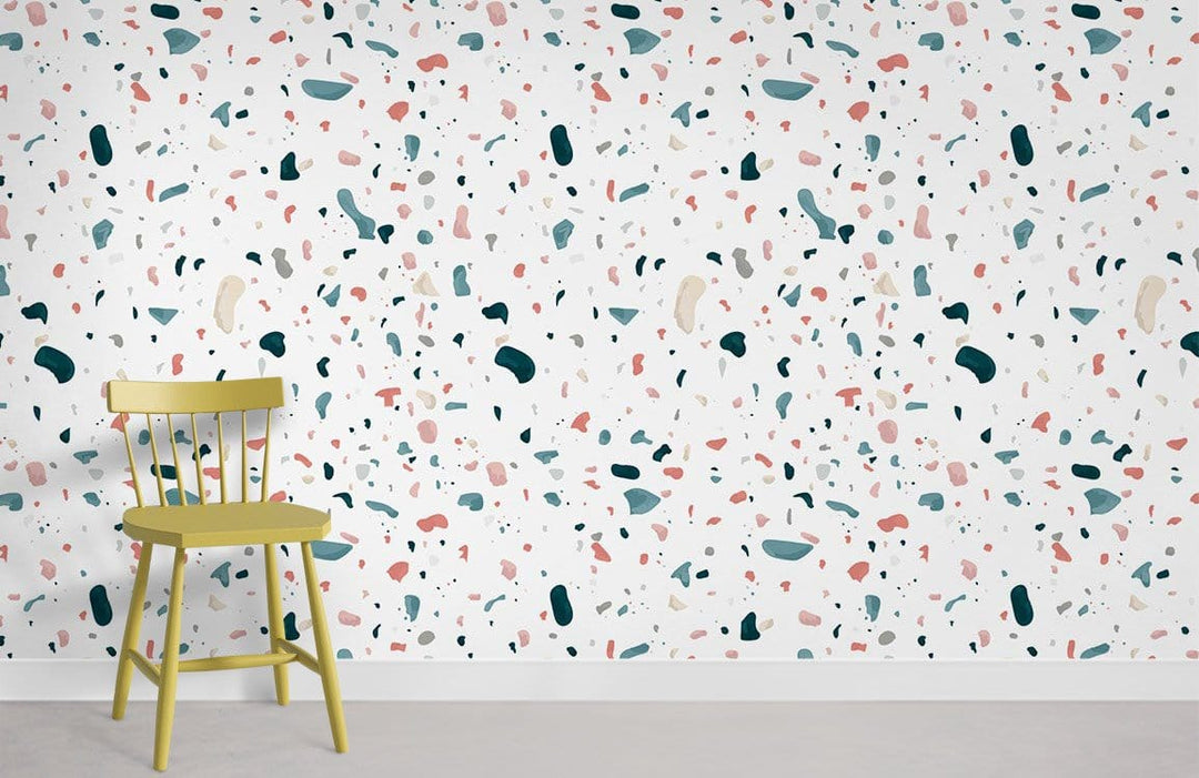 Modern multicolour terrazzo pattern wallpaper with green chair, contemporary design in a minimalist setting.