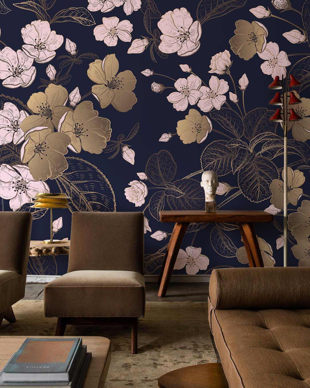 Elegant navy floral wallpaper with gold blossoms, brown mid-century armchairs, wooden table, sculpture bust.